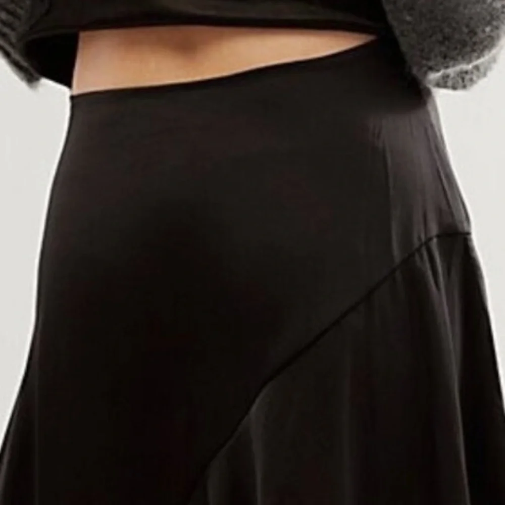 Free People size 6 Slim Shine black asymmetrical silky feel mid-rise short skirt